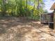 Spacious backyard with screened porch and mature trees on the perimeter at 216 Burkwood Ln, Raleigh, NC 27609