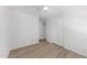 Bright bedroom with neutral paint, light floors, closet, and ceiling fan at 216 Burkwood Ln, Raleigh, NC 27609
