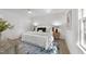 A bright bedroom featuring hardwood floors, a ceiling fan and neutral colored walls at 216 Burkwood Ln, Raleigh, NC 27609