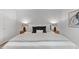 A bright bedroom features a bed with decorative pillows and bedside tables with lamps at 216 Burkwood Ln, Raleigh, NC 27609