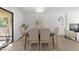 Bright dining area with a wooden table, seating for six, and access to outdoor patio at 216 Burkwood Ln, Raleigh, NC 27609