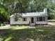 Charming single-story home with a landscaped yard and inviting brick stairs leading to the front door at 216 Burkwood Ln, Raleigh, NC 27609