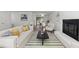 Spacious living area with fireplace, stylish decor, and an open layout leading to the dining area at 216 Burkwood Ln, Raleigh, NC 27609