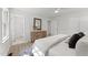 A main bedroom features a full bath, dresser, closet, and ceiling fan at 216 Burkwood Ln, Raleigh, NC 27609