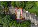 Overhead view of home's location in a wooded community with lush landscaping and mature trees at 2205 Landings Way, Raleigh, NC 27615