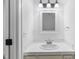 Updated bathroom with a single vanity, neutral counter, and modern lighting at 2205 Landings Way, Raleigh, NC 27615
