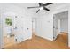 Bright bedroom with a ceiling fan and an attached bathroom, offering comfort and convenience at 2205 Landings Way, Raleigh, NC 27615