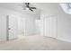 Bedroom featuring neutral carpet, a skylight, and closet storage at 2205 Landings Way, Raleigh, NC 27615