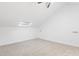 Upper level bedroom with neutral carpet, a skylight, and neutral paint at 2205 Landings Way, Raleigh, NC 27615