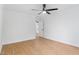 Empty bedroom with wood flooring, ceiling fan, and neutral paint ready for furnishing at 2205 Landings Way, Raleigh, NC 27615