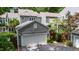 Home includes an attached two-car garage and manicured landscaping, including an American flag at 2205 Landings Way, Raleigh, NC 27615