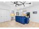 Bright kitchen features a blue island, stainless steel appliances and ample counter space at 2205 Landings Way, Raleigh, NC 27615