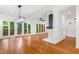 Bright living room featuring hardwood floors, a fireplace, and access to the backyard at 2205 Landings Way, Raleigh, NC 27615