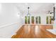 Bright living room featuring hardwood floors and access to the outdoor patio at 2205 Landings Way, Raleigh, NC 27615
