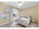 Comfortable bedroom with a ceiling fan, light-filtering shades, and a neutral color scheme at 222 Ashton Hall Ln, Raleigh, NC 27609