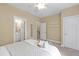 Relaxing bedroom with ensuite access, a ceiling fan, and a walk-in closet at 222 Ashton Hall Ln, Raleigh, NC 27609
