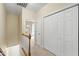 Upstairs hallway with a railing, closets, and doorways leading to other rooms at 222 Ashton Hall Ln, Raleigh, NC 27609