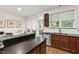Bright kitchen featuring stainless steel appliances, wooden cabinets, and a breakfast bar with dining area at 222 Ashton Hall Ln, Raleigh, NC 27609