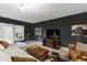 Inviting living room with a large sectional and a wall mounted television at 222 Ashton Hall Ln, Raleigh, NC 27609