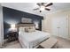 Comfortable bedroom with a decorative headboard, ceiling fan, and natural light at 222 Ashton Hall Ln, Raleigh, NC 27609