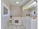 Bathroom featuring a soaking tub, white vanity, and natural light at 3009 Wellington Dr, Rocky Mount, NC 27803