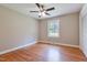 Sun-filled bedroom with hardwood floors, ceiling fan, and window at 3009 Wellington Dr, Rocky Mount, NC 27803