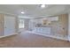 Kitchenette features white cabinets, sink, and adjacent laundry area at 3009 Wellington Dr, Rocky Mount, NC 27803