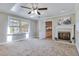 Bright living room with fireplace, skylight, and open doorway at 3009 Wellington Dr, Rocky Mount, NC 27803