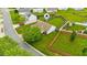Aerial view of a home with a well-manicured lawn and a charming garden area at 305 Slate Dr, Gibsonville, NC 27249