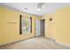 Bedroom features neutral carpet, ceiling fan, and yellow walls at 305 Slate Dr, Gibsonville, NC 27249