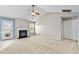 Spacious living room with vaulted ceiling, carpet flooring, ceiling fan, and fireplace at 305 Slate Dr, Gibsonville, NC 27249
