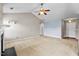 Large living room with vaulted ceilings, fireplace, and hardwood floors leading to front door at 305 Slate Dr, Gibsonville, NC 27249