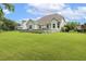 Large grassy backyard with a fenced perimeter provides an ideal space for outdoor activities at 347 Country Mill Way, Fuquay Varina, NC 27526