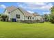 Grassy backyard with a stone patio for entertaining friends and Gathering at 347 Country Mill Way, Fuquay Varina, NC 27526