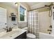 Well-lit bathroom with vanity, toilet, shower and tub combination and decorative accents at 347 Country Mill Way, Fuquay Varina, NC 27526