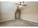 Slanted ceiling in neutral bedroom with ceiling fan at 347 Country Mill Way, Fuquay Varina, NC 27526