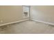 Carpeted bedroom with light-filled window at 347 Country Mill Way, Fuquay Varina, NC 27526