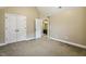 Neutral carpeted bedroom with an ensuite bathroom and closet at 347 Country Mill Way, Fuquay Varina, NC 27526