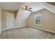 Carpeted bedroom with a ceiling fan and natural light at 347 Country Mill Way, Fuquay Varina, NC 27526