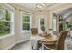 Charming dining nook with a view to the backyard and fireplace and access to the outdoor patio at 347 Country Mill Way, Fuquay Varina, NC 27526