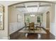 Elegant dining room with coffered ceiling, wainscoting, hardwood floors, and chandelier at 347 Country Mill Way, Fuquay Varina, NC 27526