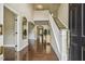 Elegant foyer with hardwood floors, staircase, soaring ceilings, and stylish decor at 347 Country Mill Way, Fuquay Varina, NC 27526
