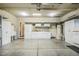 Clean and organized garage with built-in cabinets and ample storage for tools and equipment at 347 Country Mill Way, Fuquay Varina, NC 27526