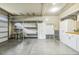 Well-organized garage featuring built-in cabinets, shelving, and work space at 347 Country Mill Way, Fuquay Varina, NC 27526