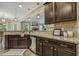 Granite countertops and stainless appliances overlooking the fireplace in the living room at 347 Country Mill Way, Fuquay Varina, NC 27526