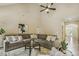Spacious living room with a large sectional sofa, high ceilings, and natural light, perfect for entertaining at 347 Country Mill Way, Fuquay Varina, NC 27526