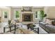 Cozy living room with a stone fireplace, comfortable seating, and a bright, airy feel at 347 Country Mill Way, Fuquay Varina, NC 27526