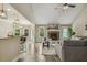 Open-concept living room featuring fireplace, tile floors, and views into dining area at 347 Country Mill Way, Fuquay Varina, NC 27526