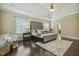 Bright bedroom features tray ceilings, hardwood floors, and natural light at 347 Country Mill Way, Fuquay Varina, NC 27526