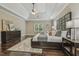 Bedroom with hardwood floors, large windows, tray ceilings, and decor at 347 Country Mill Way, Fuquay Varina, NC 27526
